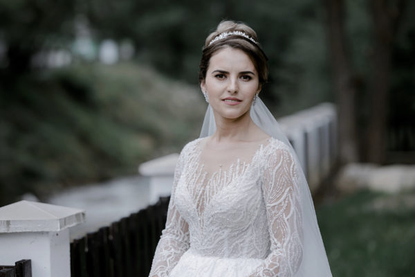 Emotional bride taking a moment to reflect on her wedding day